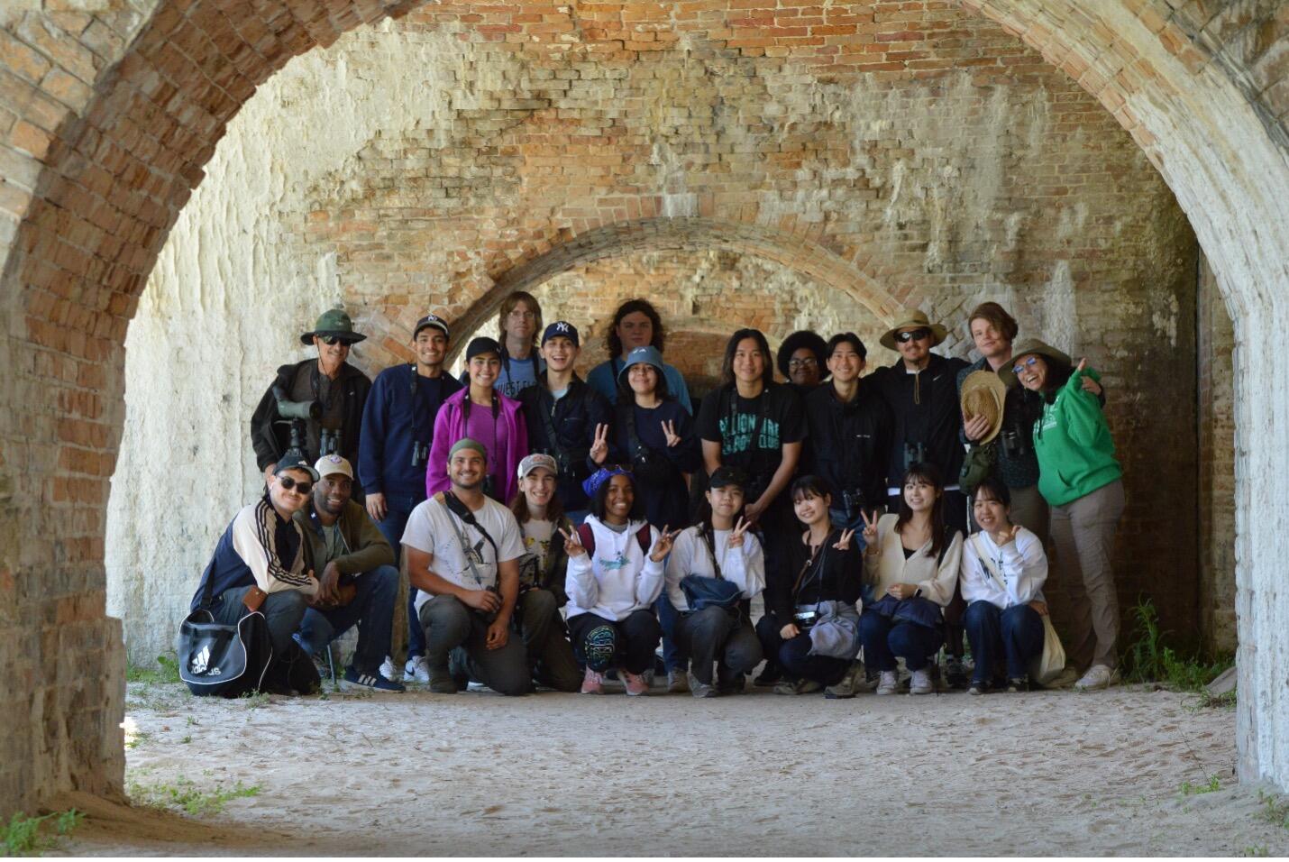 A group of college students smiling at the camera.