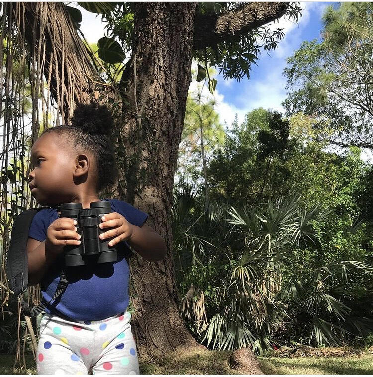 A young child goes birding.