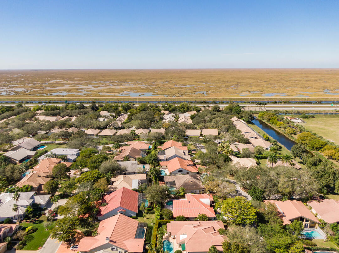 A neighborhood with a stark boundary line between the houses and the Everglades beyond.